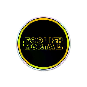 
            
                Load image into Gallery viewer, Holographic Foolish Mortals Sticker
            
        